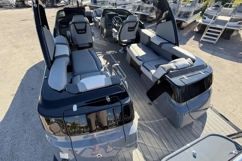 Slide: The Image of 2026 Avalon 2585 Excalibur boat interior with quad loungers and high-performance features. - 11