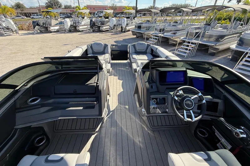 Slide: The Image of 2026 Avalon 2585 Excalibur boat interior with modern dashboard and seating. - 14