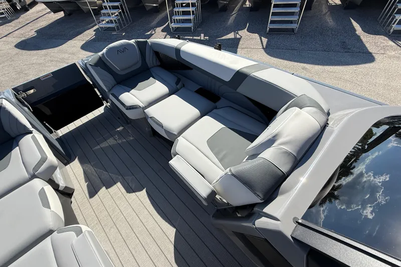 Slide: The Image of Luxurious seating on 2026 Avalon 2585 Excalibur Windshield Quad Lounger boat, featuring sleek design. - 16