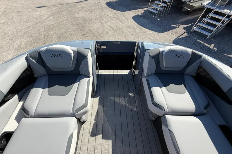 Slide: The Image of 2026 Avalon 2585 Excalibur boat interior with gray quad lounger seats and open deck. - 17