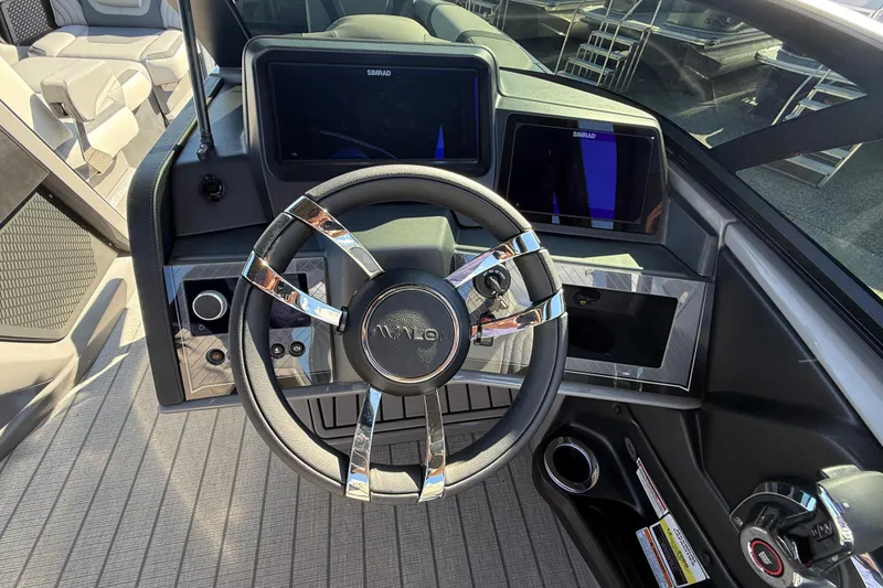 Slide: The Image of Steering wheel and dashboard of 2026 Avalon 2585 Excalibur boat with advanced controls. - 24