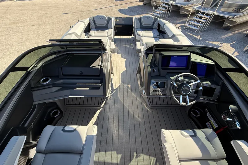 Slide: The Image of 2026 Avalon 2585 Excalibur boat interior with modern dashboard and luxurious seating. - 26