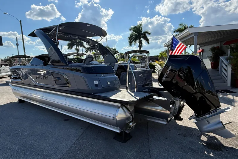 Slide: The Image of 2026 Avalon 2585 Excalibur boat with Mercury 400hp V-10 engine, parked outdoors. - 9