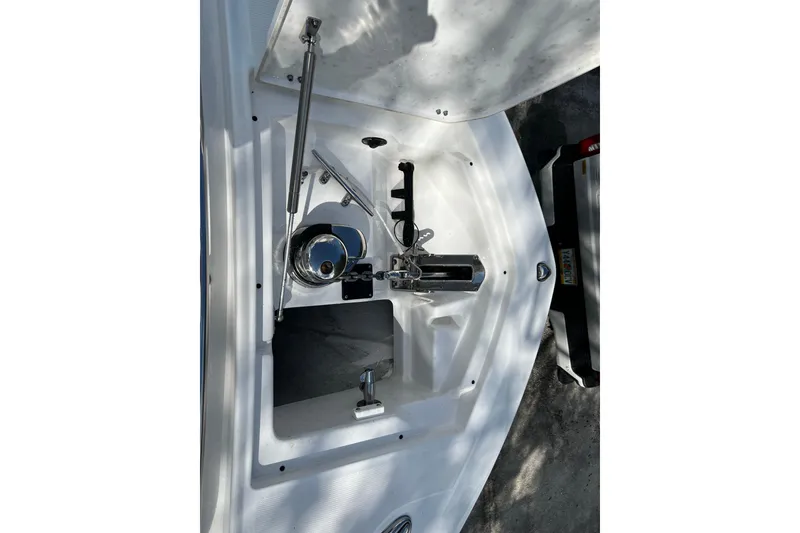 Slide: The Image of 2023 Blackfin 272 boat anchor compartment with winch and hardware. - 21