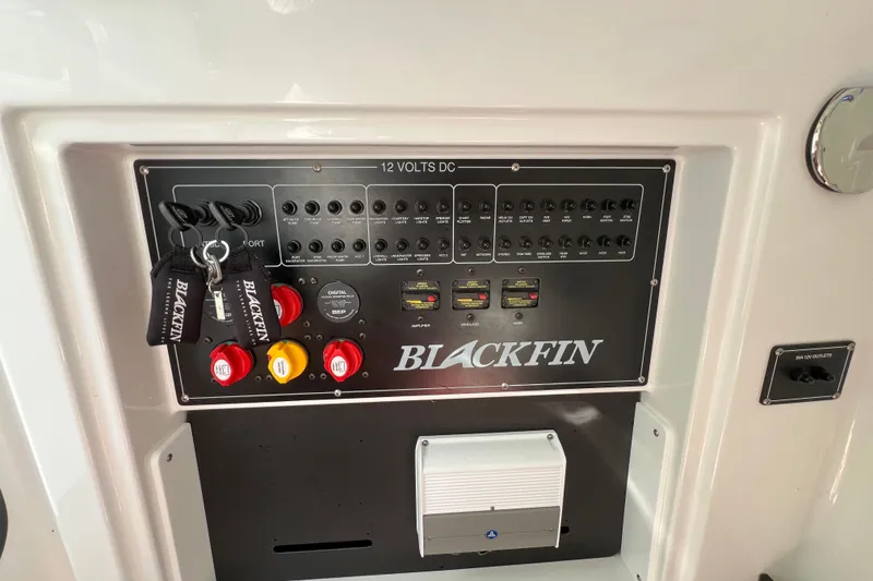 Slide: The Image of Control panel of 2023 Blackfin 272 boat with labeled switches and keys. - 23