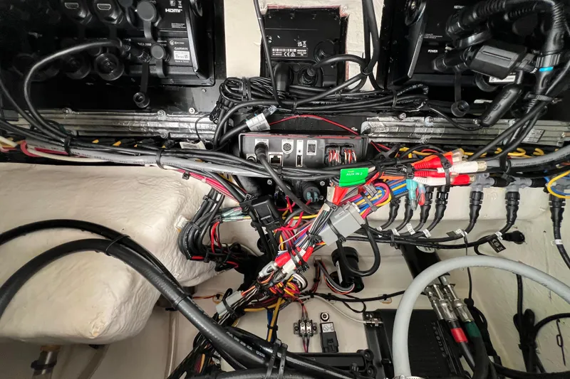 Slide: The Image of 2023 Blackfin 272 boat wiring and electronics setup with various cables and connectors. - 24
