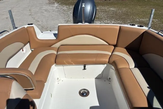 Slide: The Image of 2016 NauticStar 223 DC boat interior with tan and cream seating arrangement. - 16