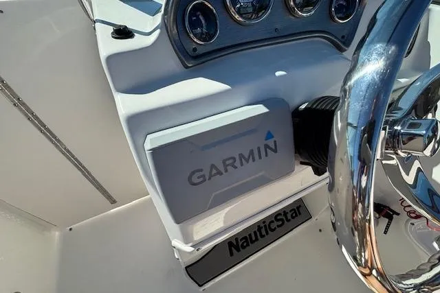 Slide: The Image of 2016 NauticStar 223 DC boat dashboard with Garmin navigation system. - 27