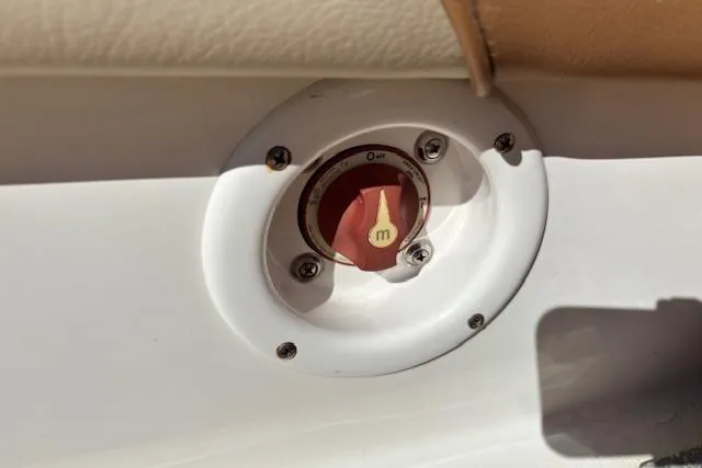 Slide: The Image of Red switch on 2016 NauticStar 223 DC boat dashboard. - 30