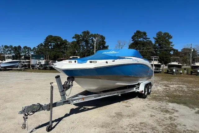 Slide: The Image of 2016 NauticStar 223 DC boat on trailer, blue cover, parked outdoors. - 37