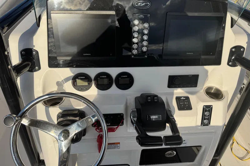 Slide: The Image of 2023 Sea Fox 268 Commander boat interior with seating and dual Yamaha engines. - 14