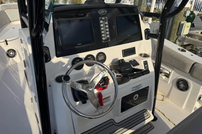 Slide: The Image of 2023 Sea Fox 268 Commander boat interior with seating and dual Yamaha engines. - 15