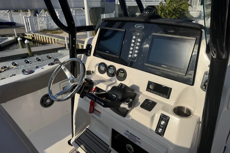 Slide: The Image of 2023 Sea Fox 268 Commander boat interior with dual Yamaha engines and seating area. - 16