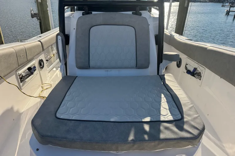 Slide: The Image of 2023 Sea Fox 268 Commander boat dashboard with Garmin navigation, docked at sunset. - 23