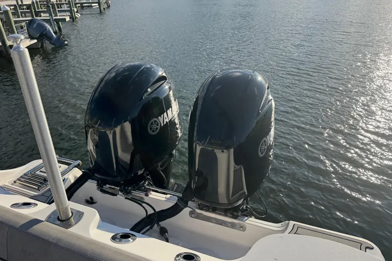 Slide: The Image of 2023 Sea Fox 268 Commander boat dashboard with steering wheel and electronic controls. - 25