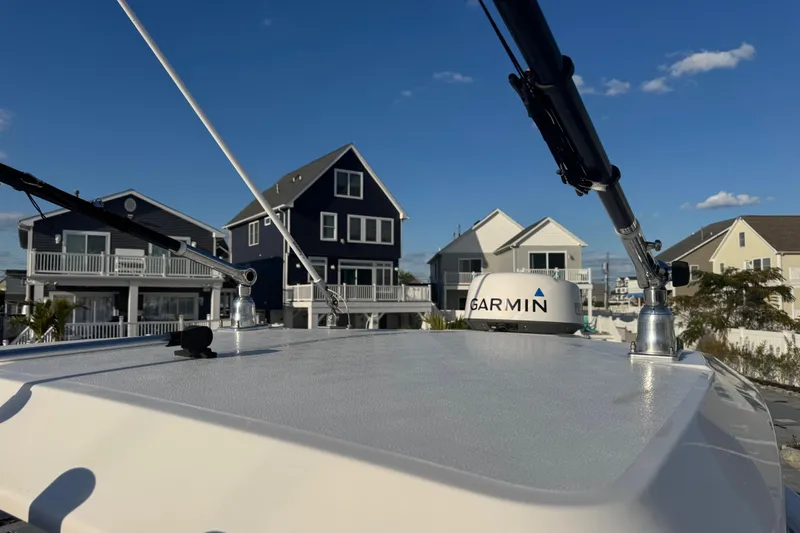 Slide: The Image of 2023 Sea Fox 268 Commander boat with Garmin equipment, docked near waterfront homes. - 38