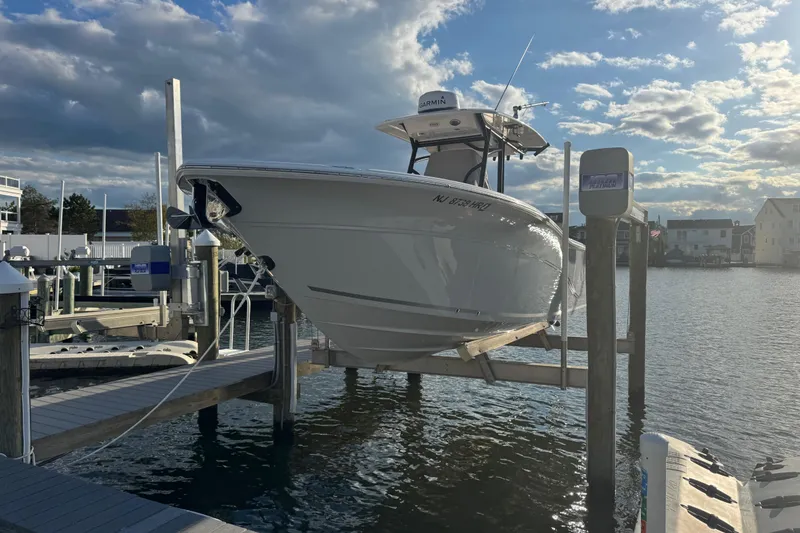 Slide: The Image of 2023 Sea Fox 268 Commander boat docked at marina under cloudy sky. - 4