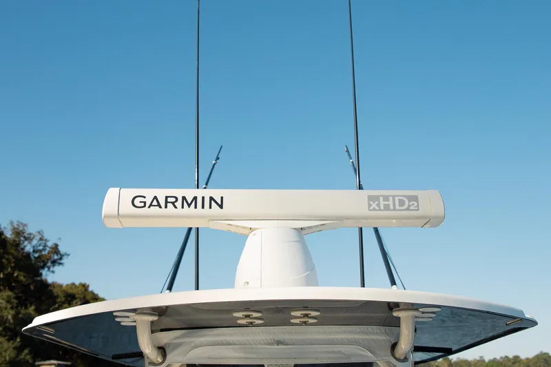 Slide: The Image of 2014 Yellowfin 34 Offshore boat with Garmin xHD2 radar against clear sky. - 16