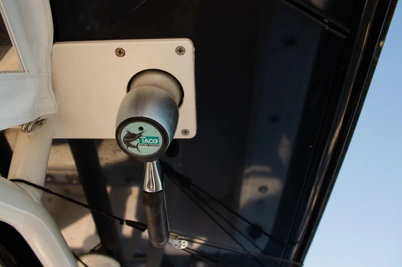 Slide: The Image of Close-up of a 2014 Yellowfin 34 Offshore boat control lever. - 22