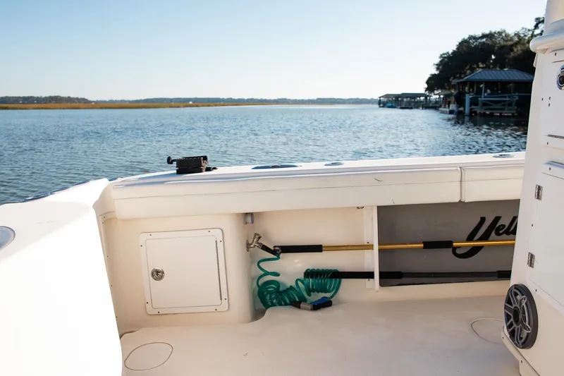 Slide: The Image of 2014 Yellowfin 34 Offshore boat interior with scenic water view. - 32