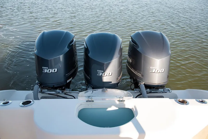Slide: The Image of Triple Yamaha 300 engines on a 2014 Yellowfin 34 Offshore boat. - 34
