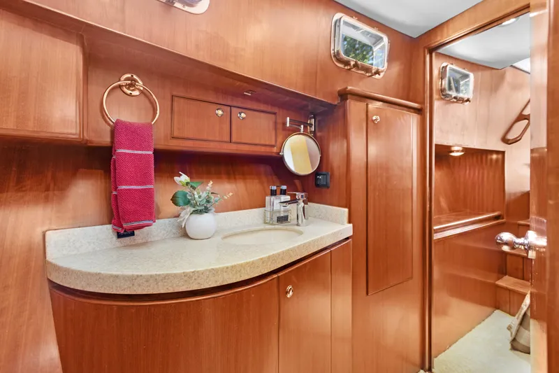Slide: The Image of Luxurious 2006 Noresman 480 Sedan yacht bathroom with wood finish and elegant fixtures. - 10
