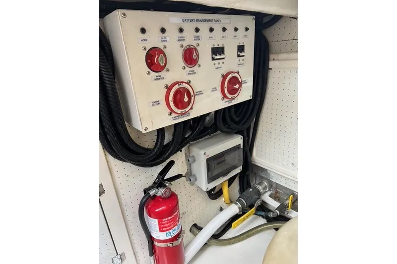 Slide: The Image of Battery management panel with fire extinguisher on 2006 Norseman 480S boat. - 102