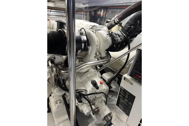 Slide: The Image of Engine room of a 2006 Norseman 480S yacht, showcasing mechanical components. - 105