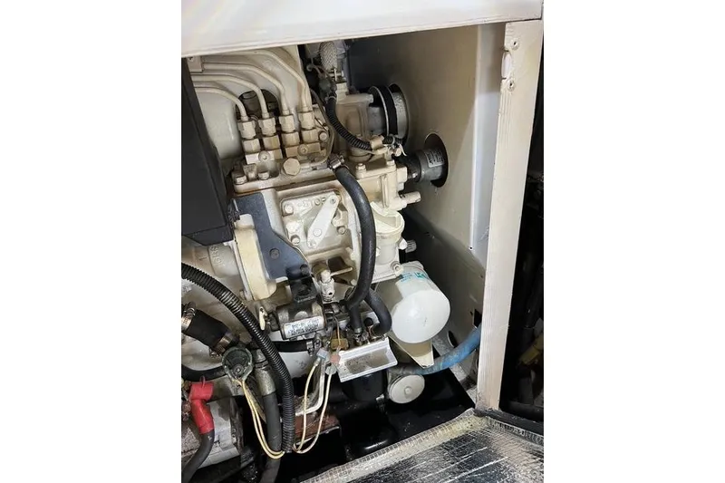 Slide: The Image of Engine compartment of a 2006 Norseman 480S, showcasing mechanical components and wiring. - 112