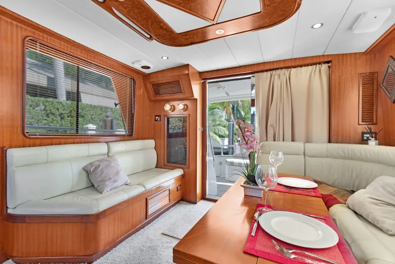 Slide: The Image of Luxurious 2006 Noresman 480 Sedan yacht interior with elegant dining area and plush seating. - 14