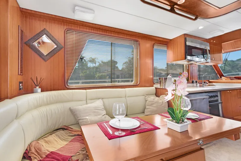 Slide: The Image of Luxurious 2006 Noresman 480 Sedan yacht interior with elegant dining area and modern kitchen. - 15