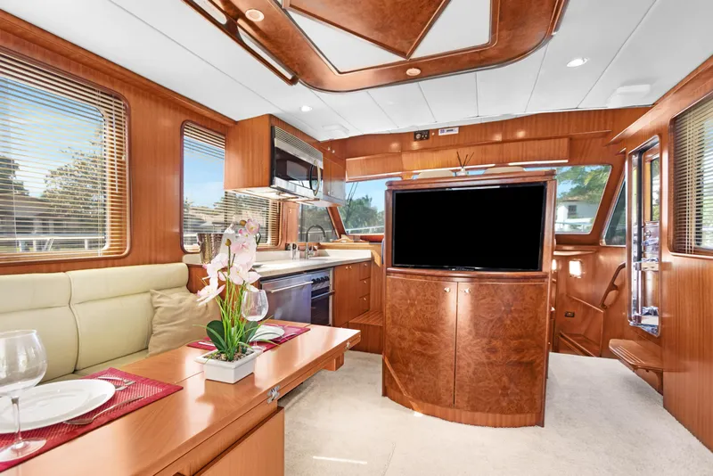 Slide: The Image of Luxurious interior of 2006 Noresman 480 Sedan yacht with wood finishes and modern amenities. - 16