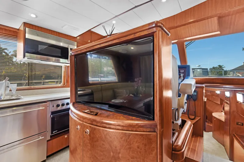 Slide: The Image of Luxurious interior of 2006 Noresman 480 Sedan yacht with modern kitchen and entertainment area. - 21