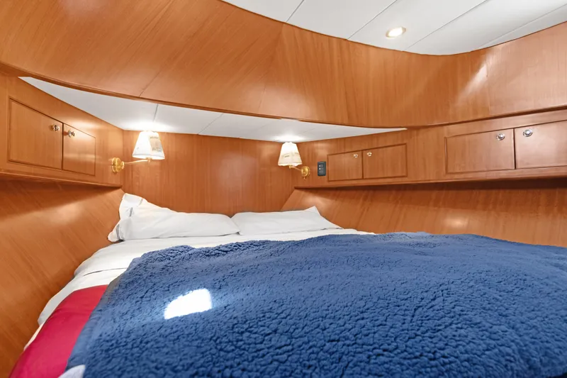 Slide: The Image of Luxurious cabin interior of 2006 Noresman 480 Sedan with cozy bedding and wooden finish. - 24