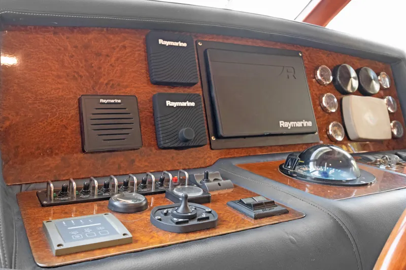 Slide: The Image of Control panel of 2006 Noresman 480 Sedan with Raymarine navigation equipment. - 33