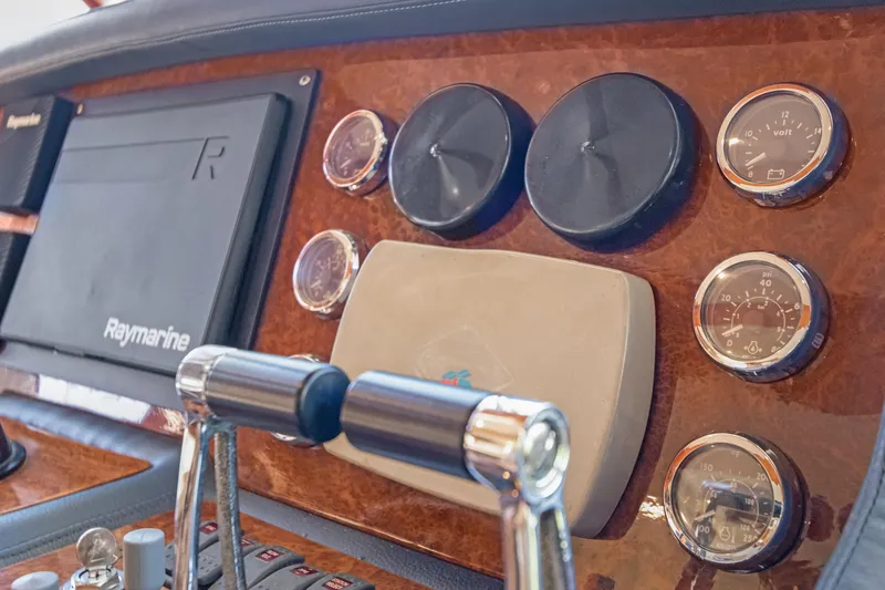 Slide: The Image of Dashboard of 2006 Noresman 480 Sedan with gauges and Raymarine equipment. - 36