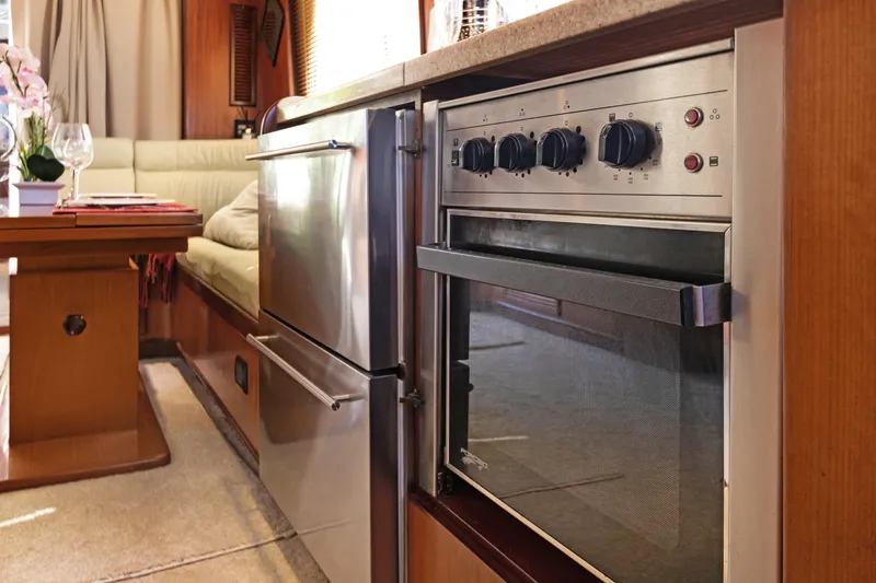 Slide: The Image of Luxurious 2006 Noresman 480 Sedan interior with modern kitchen and dining area. - 37