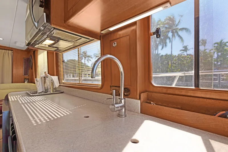 Slide: The Image of Interior of 2006 Noresman 480 Sedan yacht kitchen with sink and window view. - 38