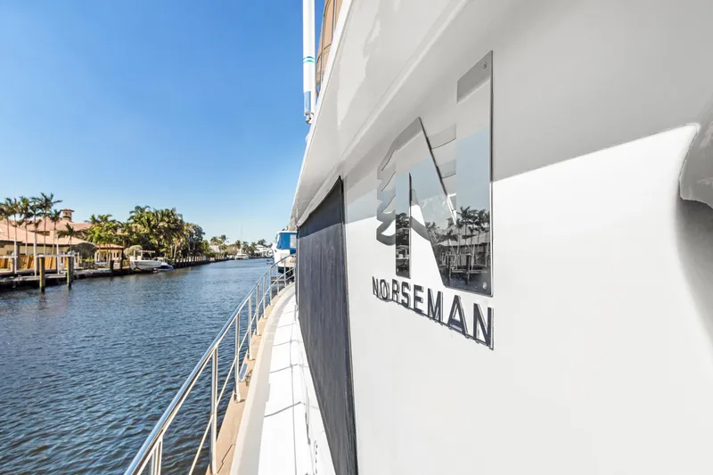 Slide: The Image of Side view of 2006 Noresman 480 Sedan yacht on a sunny waterway. - 44