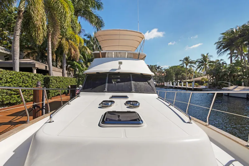 Slide: The Image of 2006 Noresman 480 Sedan yacht docked by tropical waterfront. - 45