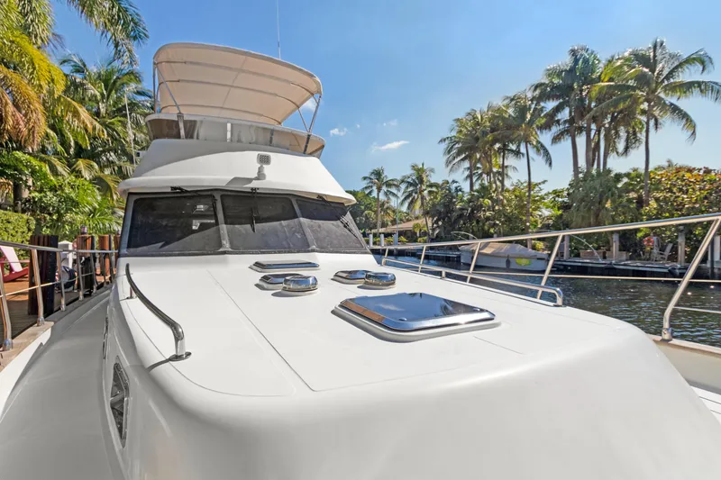 Slide: The Image of Luxury Noresman 480 Sedan yacht docked near tropical palm trees, 2006 model. - 46