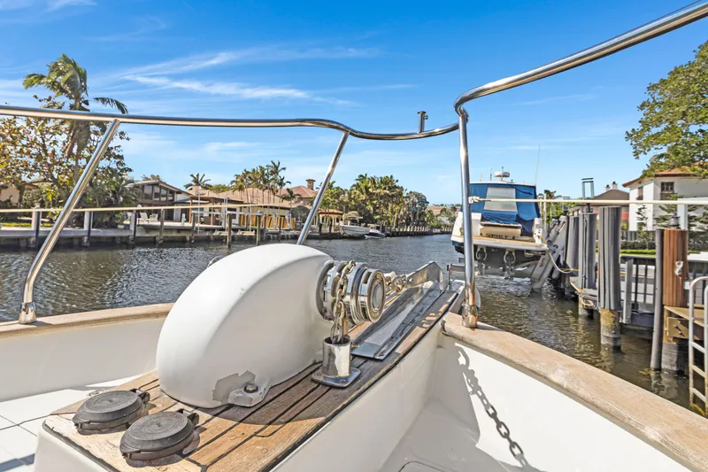 Slide: The Image of Bow view of 2006 Noresman 480 Sedan yacht docked in a scenic canal. - 48