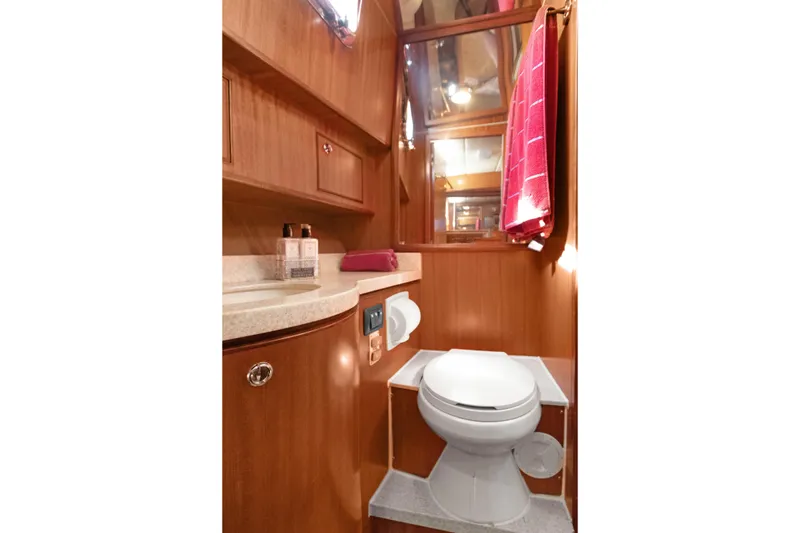 Slide: The Image of Luxurious bathroom in 2006 Noresman 480 Sedan yacht with wooden cabinetry and modern fixtures. - 5