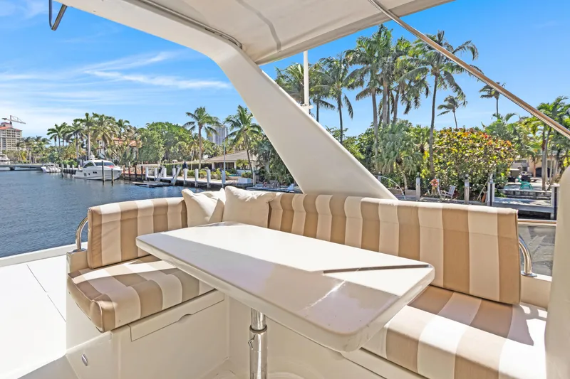 Slide: The Image of Luxurious 2006 Noresman 480 Sedan yacht with elegant seating and waterfront view. - 55