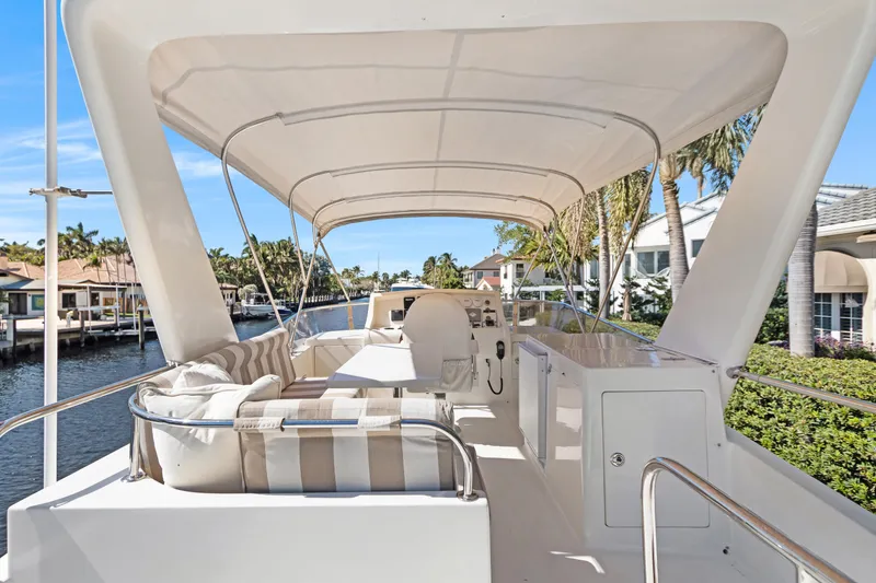 Slide: The Image of Luxurious 2006 Noresman 480 Sedan yacht interior with elegant seating and scenic waterfront view. - 59