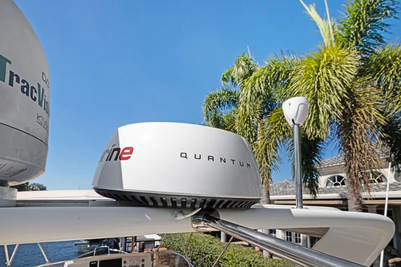 Slide: The Image of Radar equipment on a 2006 Noresman 480 Sedan yacht, with palm trees in the background. - 60