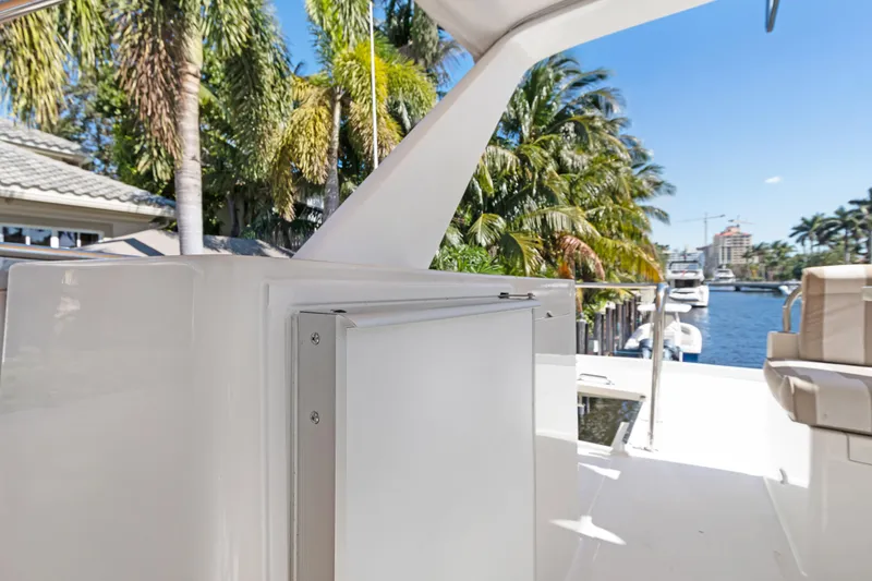 Slide: The Image of Luxury Noresman 480 Sedan yacht deck with palm trees and waterfront view, 2006 model. - 62