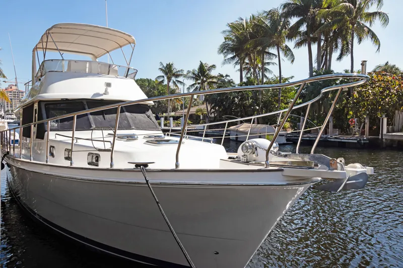 Slide: The Image of 2006 Noresman 480 Sedan yacht docked by palm trees in sunny marina. - 66