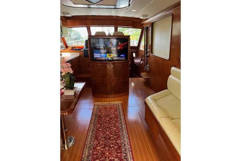 Slide: The Image of Luxurious 2006 Norseman 480S yacht interior with wood finish, TV, and elegant decor. - 77