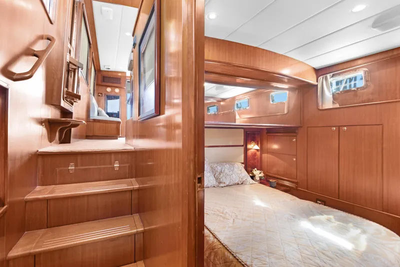 Slide: The Image of Luxurious interior of 2006 Noresman 480 Sedan yacht with cozy bedroom and wooden finishes. - 8